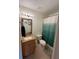 Bathroom featuring shower/tub combo with decorative shower curtain and granite countertops at 3651 N Goldenrod E Rd # 102, Winter Park, FL 32792