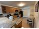 Kitchen featuring granite countertops, stainless steel appliances, and adjacent dining area at 3651 N Goldenrod E Rd # 102, Winter Park, FL 32792
