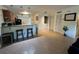 Kitchen and bar with pendant lights and access to laundry room at 3651 N Goldenrod E Rd # 102, Winter Park, FL 32792
