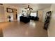 Spacious living room with tile floors, fan, and neutral decor at 3651 N Goldenrod E Rd # 102, Winter Park, FL 32792