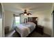 Bedroom with ceiling fan, neutral walls, and natural light from the window at 3651 N Goldenrod E Rd # 102, Winter Park, FL 32792