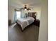 Bedroom with ceiling fan, neutral walls, and natural light from the window at 3651 N Goldenrod E Rd # 102, Winter Park, FL 32792