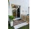 Outdoor patio space featuring sliding glass doors and a privacy fence at 3651 N Goldenrod E Rd # 102, Winter Park, FL 32792