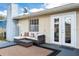 Cozy outdoor patio furnished with a sectional and a coffee table, creating an inviting lounge space at 4851 Ne 7Th St, Ocala, FL 34470