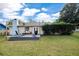 Inviting backyard deck with stylish furniture, perfect for enjoying the outdoors and entertaining guests in comfort at 4851 Ne 7Th St, Ocala, FL 34470