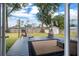 Outdoor living on a deck, featuring patio furniture and overlooking the expansive backyard with a shed at 4851 Ne 7Th St, Ocala, FL 34470