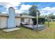 Cozy backyard deck with comfortable seating, ideal for outdoor entertaining and relaxing with friends at 4851 Ne 7Th St, Ocala, FL 34470