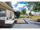 Outdoor patio with comfortable seating that overlooks the lush yard space, ideal for entertaining at 4851 Ne 7Th St, Ocala, FL 34470