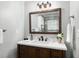 Bathroom vanity with a dark wood finish and quartz countertop, providing style and functionality at 4851 Ne 7Th St, Ocala, FL 34470