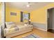 Comfortable bedroom with a daybed, window views, and soft, inviting decor that creates a relaxing ambiance at 4851 Ne 7Th St, Ocala, FL 34470