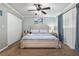 Bright bedroom featuring a ceiling fan, and ample natural light enhancing the serene atmosphere at 4851 Ne 7Th St, Ocala, FL 34470