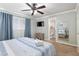 Comfortable bedroom featuring a ceiling fan, carpet floors, and soothing blue accents for a relaxing ambiance at 4851 Ne 7Th St, Ocala, FL 34470