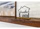 Closeup of decorative shelf items, rustic wooden, above brick fireplace at 4851 Ne 7Th St, Ocala, FL 34470