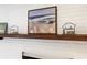 Close-up of decorative mantel above white brick fireplace at 4851 Ne 7Th St, Ocala, FL 34470