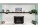 A rustic wooden mantle tops a white brick fireplace at 4851 Ne 7Th St, Ocala, FL 34470