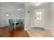 Inviting foyer featuring tile floors, adjacent to a formal dining area with a wooden table and chairs at 4851 Ne 7Th St, Ocala, FL 34470