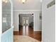 Welcoming foyer with hardwood floors, leading to a bright living room with glass doors to the backyard at 4851 Ne 7Th St, Ocala, FL 34470