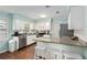 Open kitchen boasts granite counters, stainless appliances, tile backsplash and breakfast bar at 4851 Ne 7Th St, Ocala, FL 34470