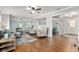 Open concept living room with neutral colors, hardwood floors, and comfortable seating at 4851 Ne 7Th St, Ocala, FL 34470