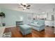 Cozy living room featuring blue furnishings, an office nook, and an open floor plan to the kitchen at 4851 Ne 7Th St, Ocala, FL 34470