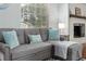 Close-up of cozy living room with throw pillows on a gray couch at 4851 Ne 7Th St, Ocala, FL 34470