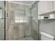 Modern bathroom with a glass-enclosed shower and tiled walls, creating a spa-like experience at 4851 Ne 7Th St, Ocala, FL 34470