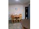 Cozy dining area with wooden table and chairs at 11301 Huggins St, Leesburg, FL 34788