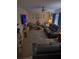 Cozy living room with comfortable seating, ceiling fan, and a decorative rug at 11301 Huggins St, Leesburg, FL 34788