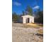 Exterior view of the property's detached storage shed at 11301 Huggins St, Leesburg, FL 34788