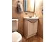 Bathroom vanity featuring a sink, mirror, and storage cabinet at 14545 Sw 34Th Terrace Rd, Ocala, FL 34473