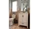 Cozy bathroom with white vanity, soft lighting, and neutral tile floors at 14545 Sw 34Th Terrace Rd, Ocala, FL 34473