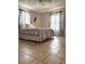 Cozy bedroom with tile flooring, natural light, and modern decor at 14545 Sw 34Th Terrace Rd, Ocala, FL 34473