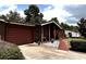 Front exterior view of a well-maintained home with a driveway and landscaped yard at 14545 Sw 34Th Terrace Rd, Ocala, FL 34473