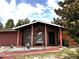 Charming single-story home featuring a brick facade, covered porch, and well-manicured landscaping at 14545 Sw 34Th Terrace Rd, Ocala, FL 34473