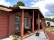 Inviting front porch with brick pillars and decorative landscaping welcomes you home at 14545 Sw 34Th Terrace Rd, Ocala, FL 34473