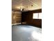 Spacious garage interior with an open door, overhead lighting, and gray floor at 14545 Sw 34Th Terrace Rd, Ocala, FL 34473