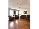 Bright living room boasts laminate flooring, neutral walls, and ample seating at 14545 Sw 34Th Terrace Rd, Ocala, FL 34473