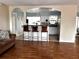 Open-concept living area with laminate floors flows into the kitchen, perfect for entertaining at 14545 Sw 34Th Terrace Rd, Ocala, FL 34473