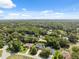 Aerial view of a quiet, wooded residential neighborhood at 8929 Sw 196Th Ct, Dunnellon, FL 34432