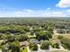 Aerial view of home nestled in a lush, wooded neighborhood at 8929 Sw 196Th Ct, Dunnellon, FL 34432