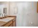 Simple bathroom with a sink, a mirror, a towel rack, and a toilet paper holder at 8929 Sw 196Th Ct, Dunnellon, FL 34432