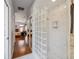 Modern bathroom with a glass block shower and an open doorway to a bedroom at 8929 Sw 196Th Ct, Dunnellon, FL 34432