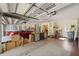 Spacious garage with ample storage, a workbench, and room for multiple vehicles at 8929 Sw 196Th Ct, Dunnellon, FL 34432
