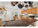 Bright kitchen features granite countertops, wooden cabinets, stainless steel appliances and a large island at 8929 Sw 196Th Ct, Dunnellon, FL 34432