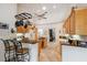 Spacious kitchen with wooden cabinets, granite countertops, pendant lights, and modern appliances at 8929 Sw 196Th Ct, Dunnellon, FL 34432