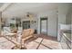 Enjoy this covered patio with brick floors, offering a dining area and convenient outdoor access at 8929 Sw 196Th Ct, Dunnellon, FL 34432