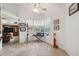Sunlit sitting area with bay window, neutral tile floor, and decorative accents at 8929 Sw 196Th Ct, Dunnellon, FL 34432