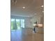 Open floor plan with bright, airy kitchen with stainless appliances and an island at 1129 Red Buckeye Ct, Deland, FL 32720