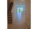 Living area shows open floor plan with kitchen in view at 1129 Red Buckeye Ct, Deland, FL 32720