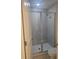 Modern bathroom with tiled shower featuring a glass enclosure and new fixtures at 1133 Red Buckeye Ct, Deland, FL 32720